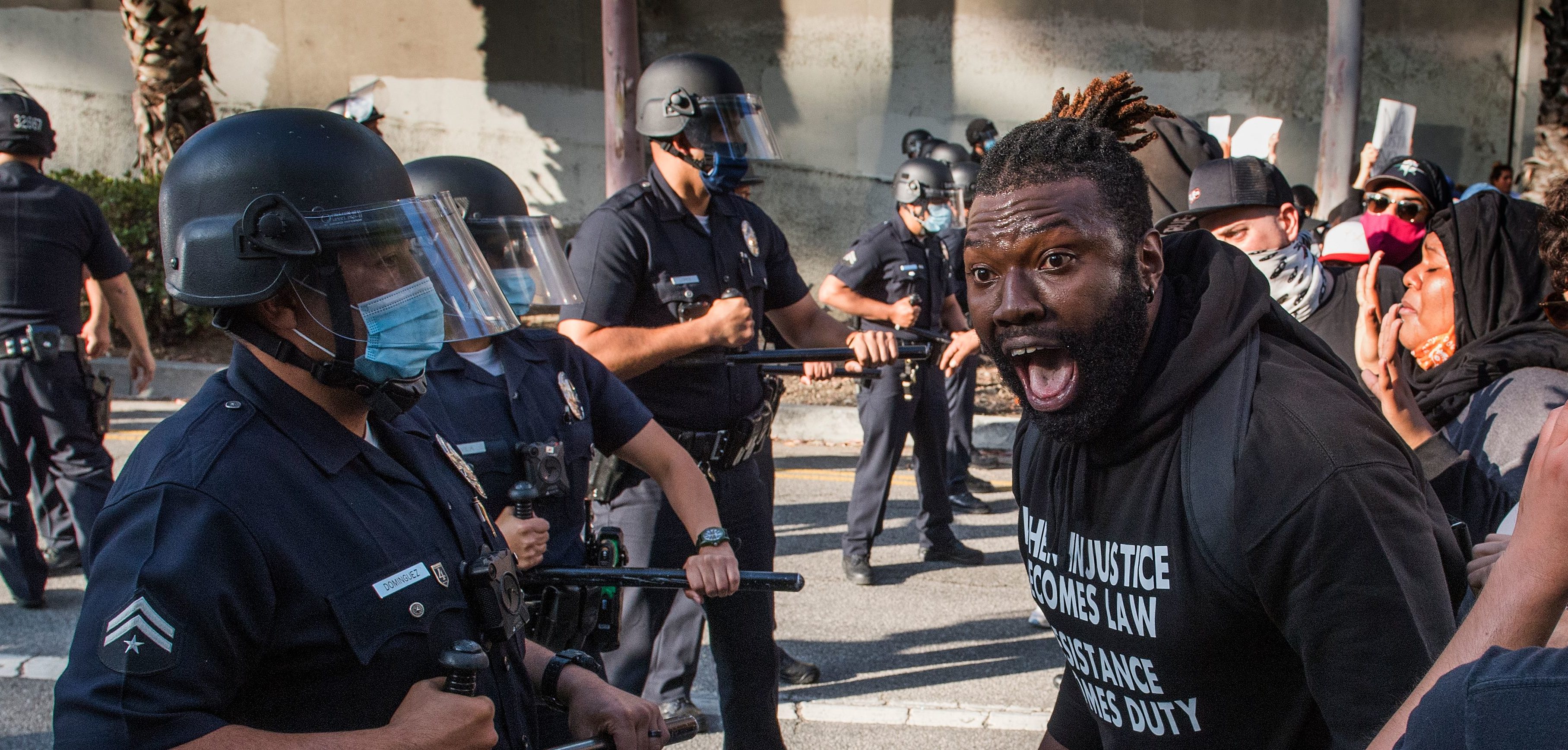 A demonstrator confronts police as he protests the death of George Floyd, in Los Angeles, California on May 29, 2020.