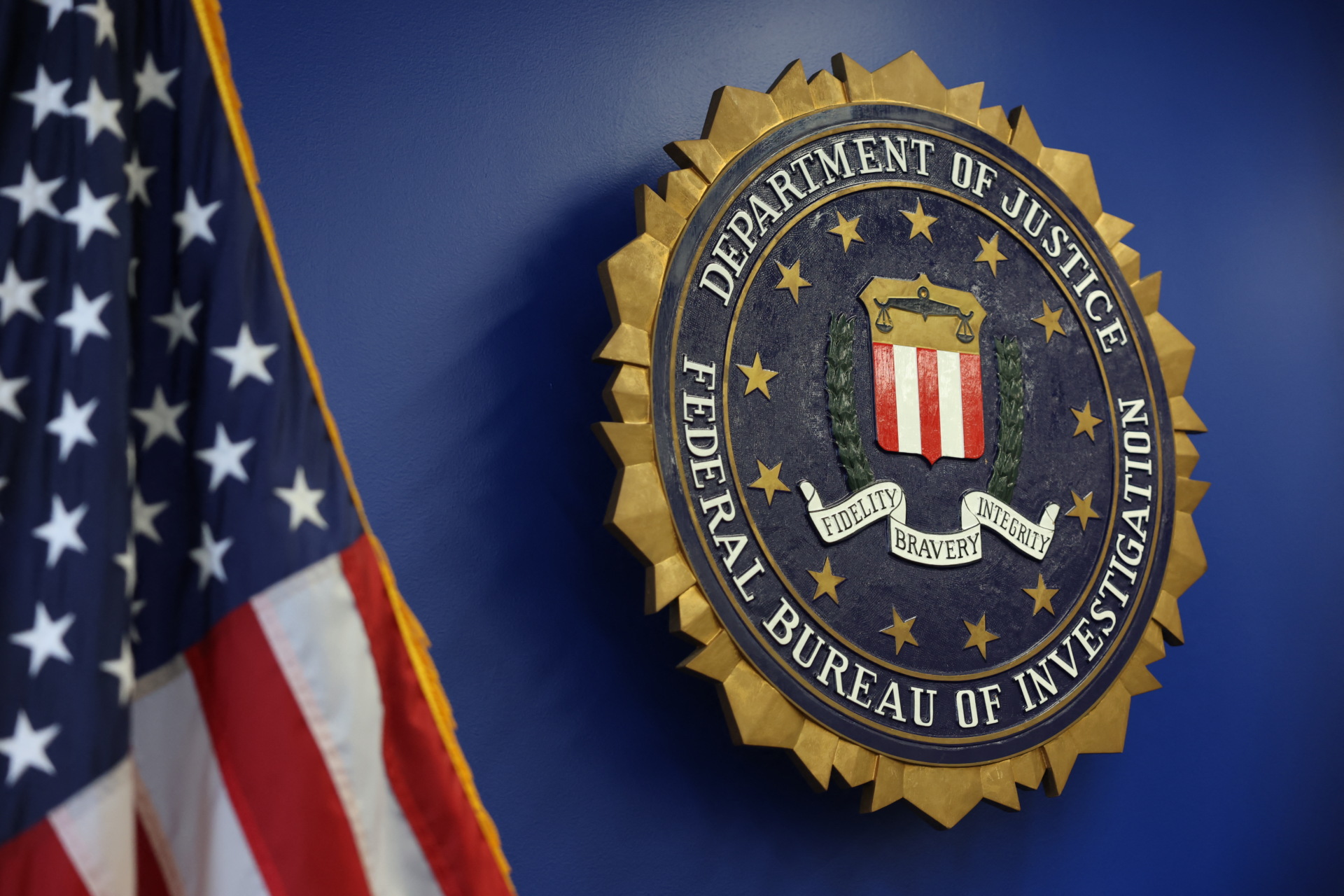 The logo of the Federal Bureau of Investigation (FBI) is seen at the Los Angeles Federal Building after a news conference to provide an update on the investigation into a May 18, 2025, bombing at a fertility clinic in Palm Springs, California, on June 4, 2025, in Los Angeles. Daniel Park, 32 from Washington state, was arrested by the FBI at John F. Kennedy International Airport on June 3, 2025, as he was arriving. He is a suspect in the investigation into the May 18, 2025, bombing at a fertility clinic in Palm Springs, California. (Photo by PATRICK T. FALLON/AFP via Getty Images)