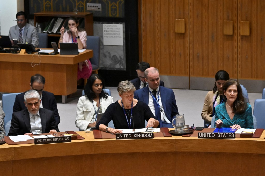 US Ambassador to the UN Dorothy Camille Shea (R) speaks during a Security Council Meeting as Iranian UN Ambassador Amir Saeid Iravani (L) looks on.