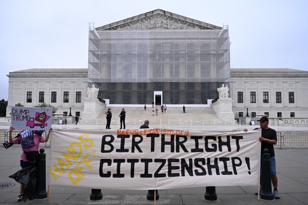 Demonstrators hold up “Birthright Citizenship” sign outside the US Supreme Court in Washington, DC, on June 27, 2025. (Photo by ALEX WROBLEWSKI/AFP via Getty Images)